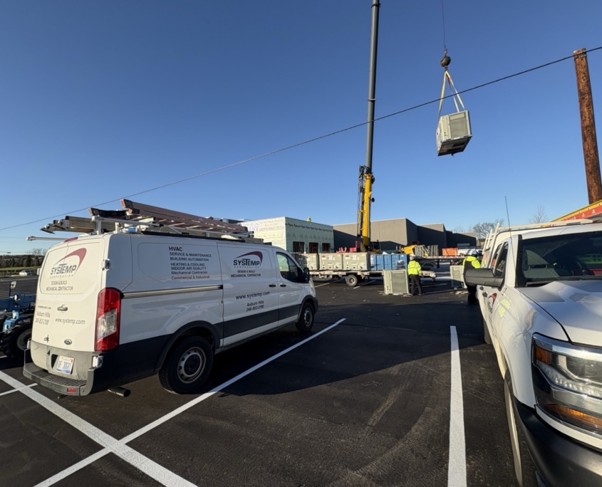 SysTemp Corp van on site of HVAC installation